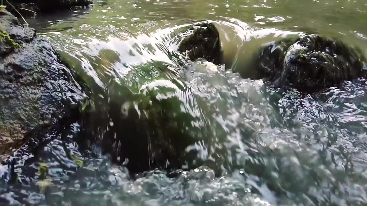 View of water pouring in a small waterfall