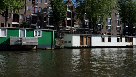 sailing through the canals of amsterdam: a relaxing cruise, with beautiful typical amsterdam houseboats