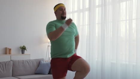 overweight man doing exercise at home