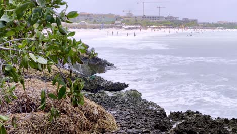 surf crashes along the shore in aruba near eagle beach