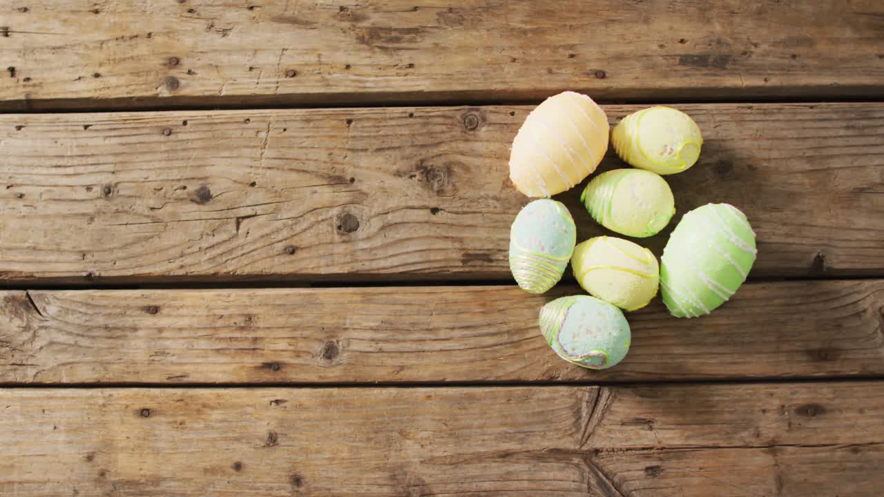 Video of decorated colorful easter eggs on a wooden surface