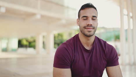 Young-man-smiling-to-the-camera-outdoors.