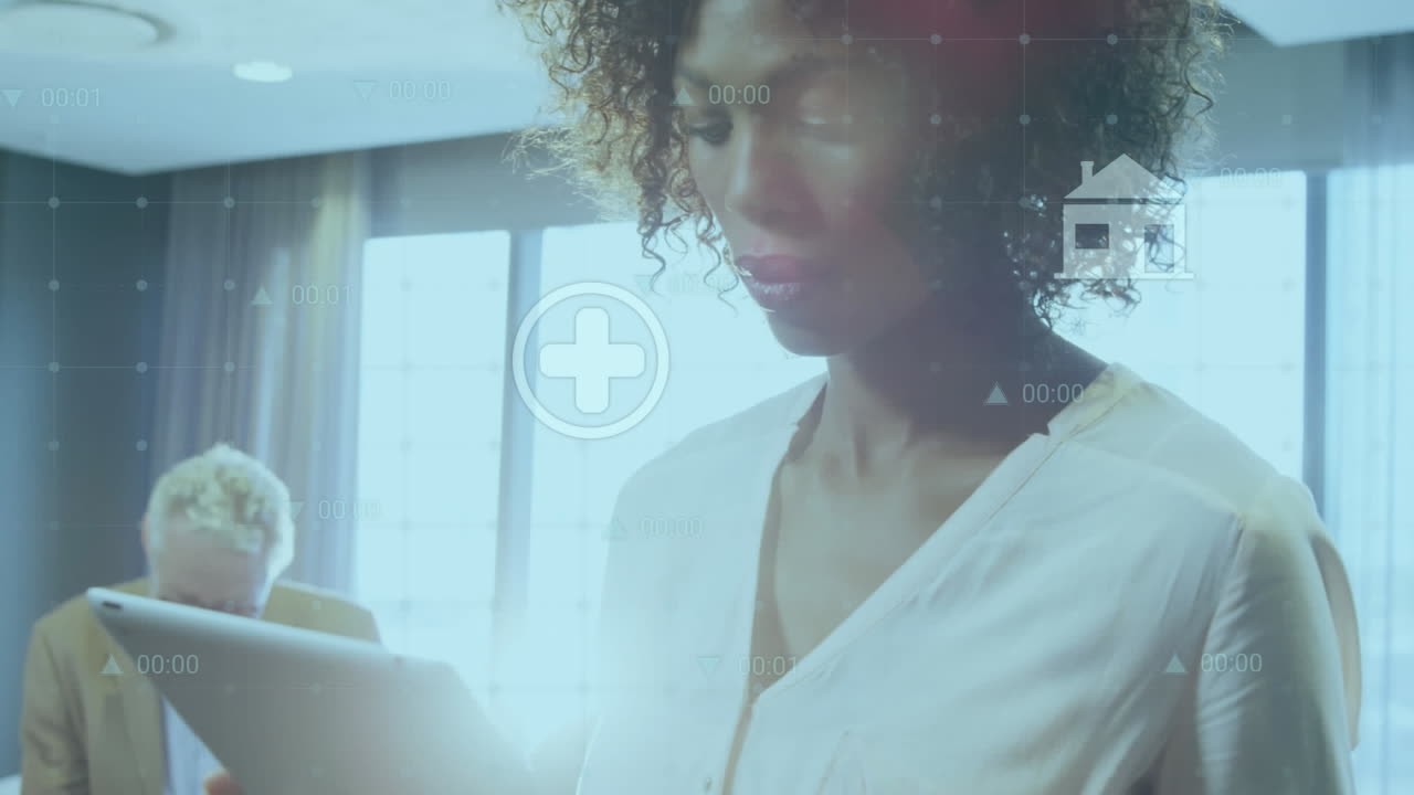 Animation of data processing against african american woman while using digital tablet at office