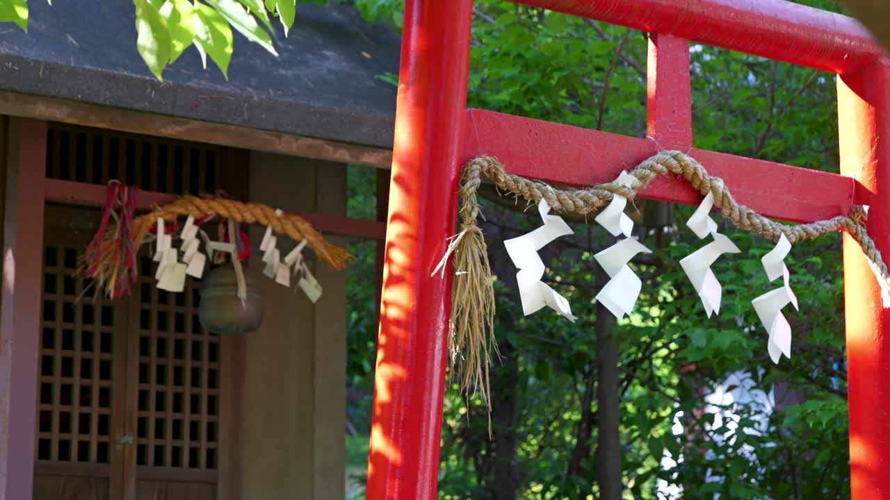 Slow motion reveal of details at Japanese shinto shrine