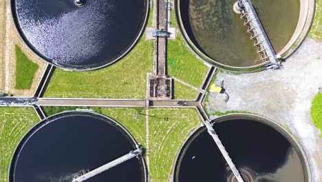 aerial top view of circular ponds in wastewater treatment plant and filtration of dirty sewage water