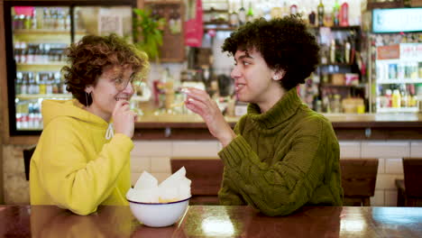 lesbian couple in a bar