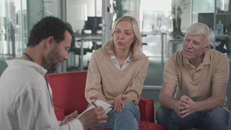 an elderly couple consults with a young black doctor 1