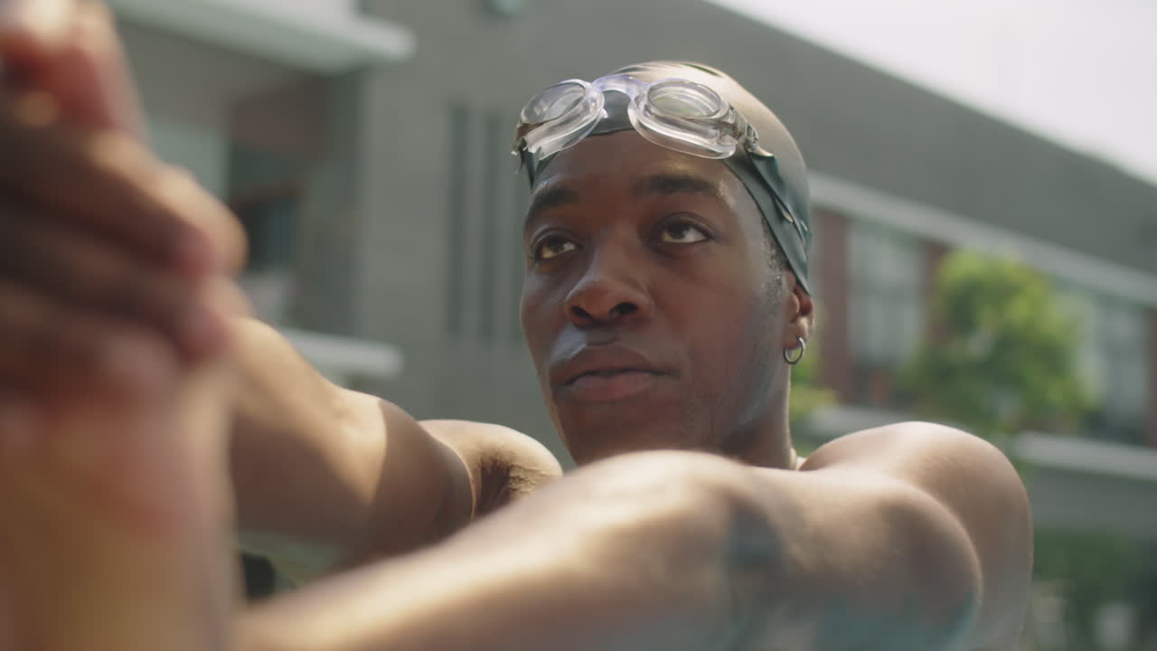 African American Athlete Warming Up for Swimming in Pool