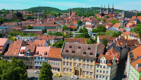4k aerial drone video of the historic castle, cathedral, abbey and church along the regnitz river in the old town area of downtown bamberg, germany