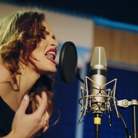 woman singing in a recording studio. female vocals. professional recording studio. square video
