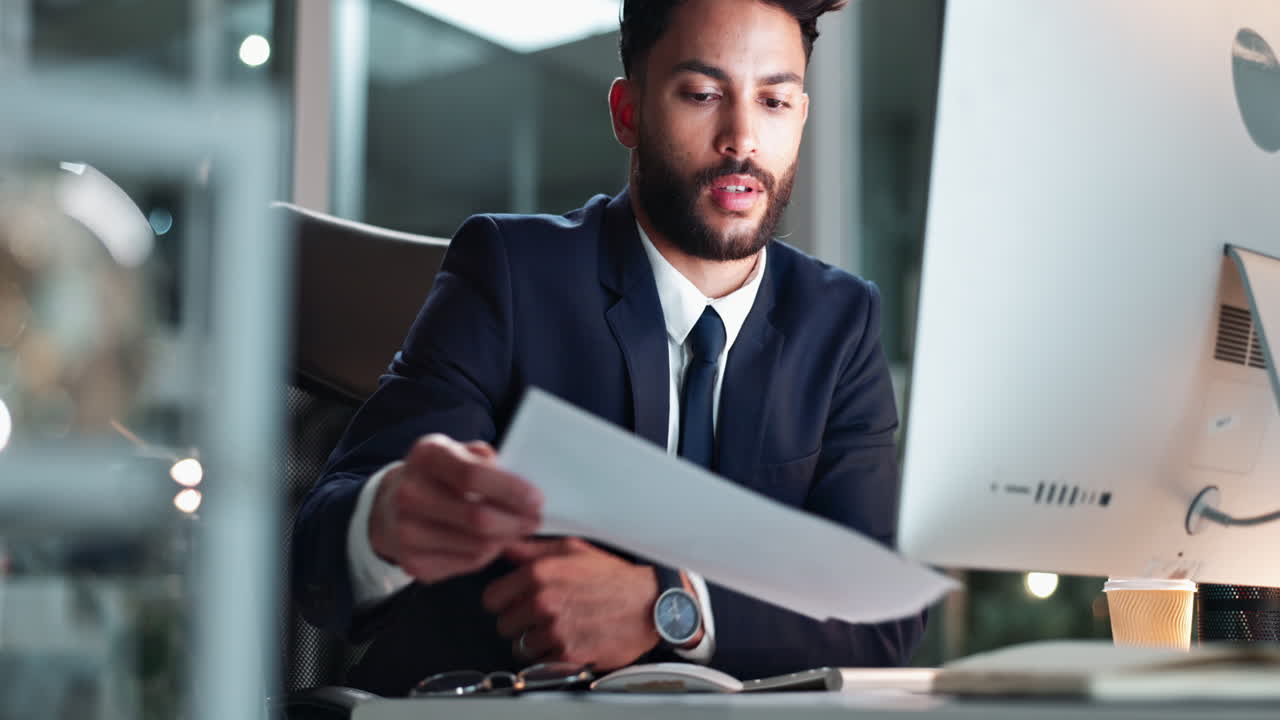 A businessman working at his computer in the office