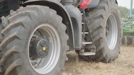 demonstration of agricultural machinery at an exhibition. tractors operate in the field, showcasing their capabilities and performance in action