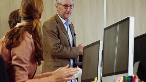 Coworkers-applauding-a-colleague-after-presentation