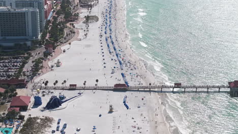 aerial view over clearwater beach ascending up and panning left across hotels