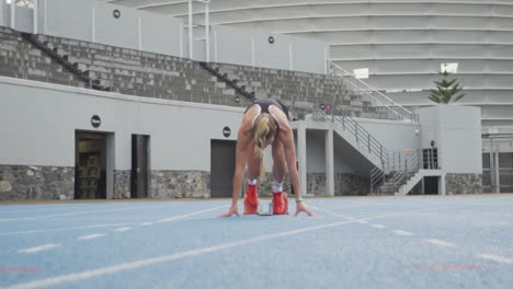 Caucasian-athlete-running-in-stadium