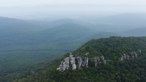 An-aerial-shot-of-Big-Schloss-and-Great-North-Mountain-in-the-evening-in-the-summer,-located-on-the-Virginia-West-Virginia-Border-within-the-George-Washington-National-Forest