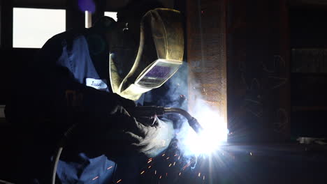 A-man-welding-beams-for-a-walking-bridge-in-slow-motion