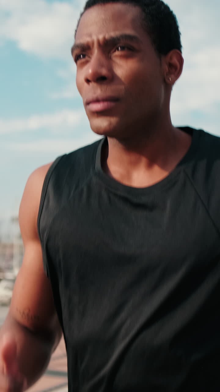 Determined Male Athlete Runs Through City