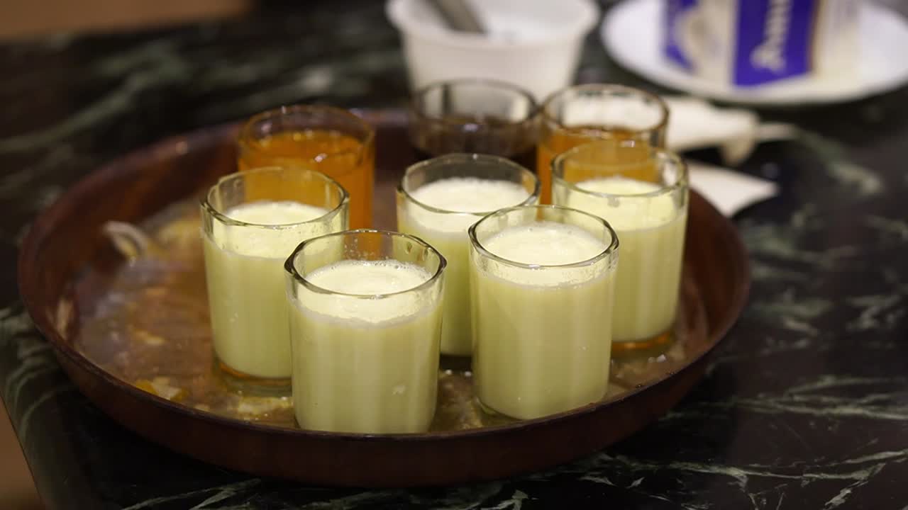 Profile view of milk shake and soft drinks to be served to guests in wedding.