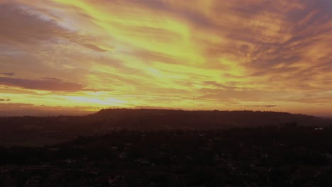 aerial panoramic view of breathtaking sunset over hills