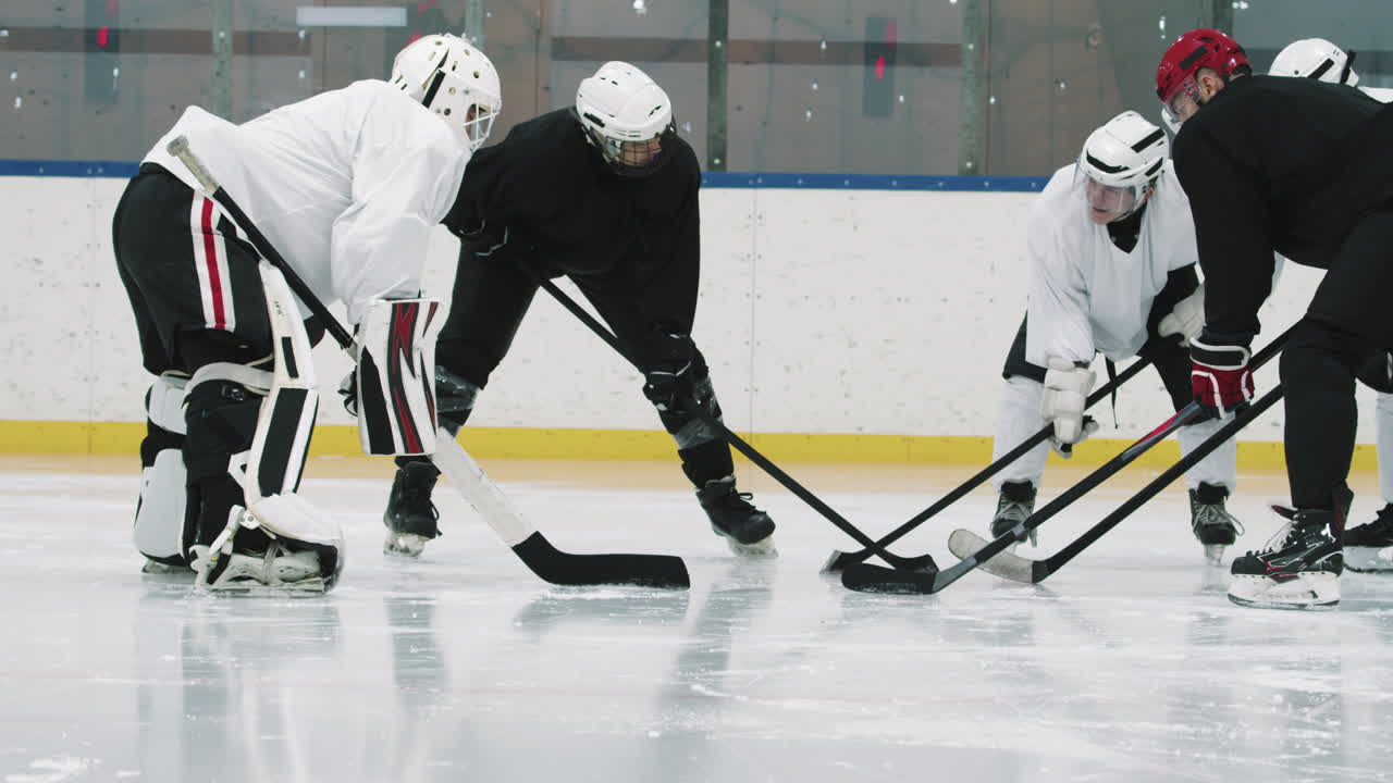 Hockey Players Standing In Circle With Sticks
