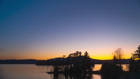 sunset to dusk time lapse over new england lake golden hour blue hour 4k 30p