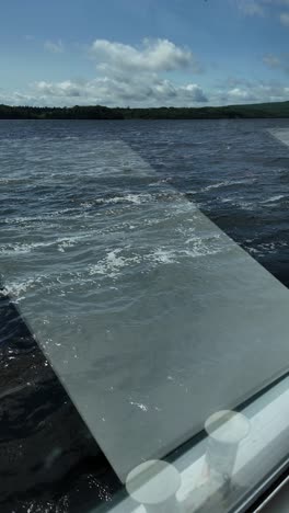 inside a passenger boat: clean interior with large windows and view
