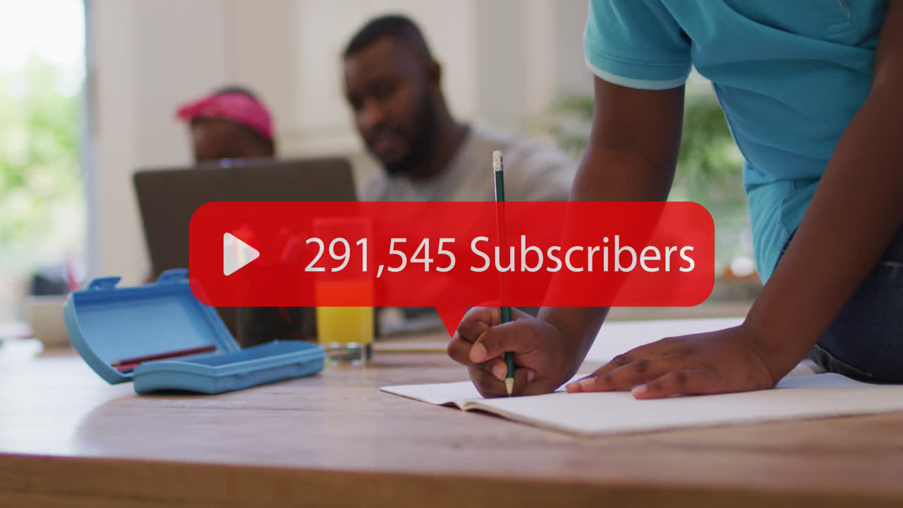 Animation of media icon over african american man using laptop with children