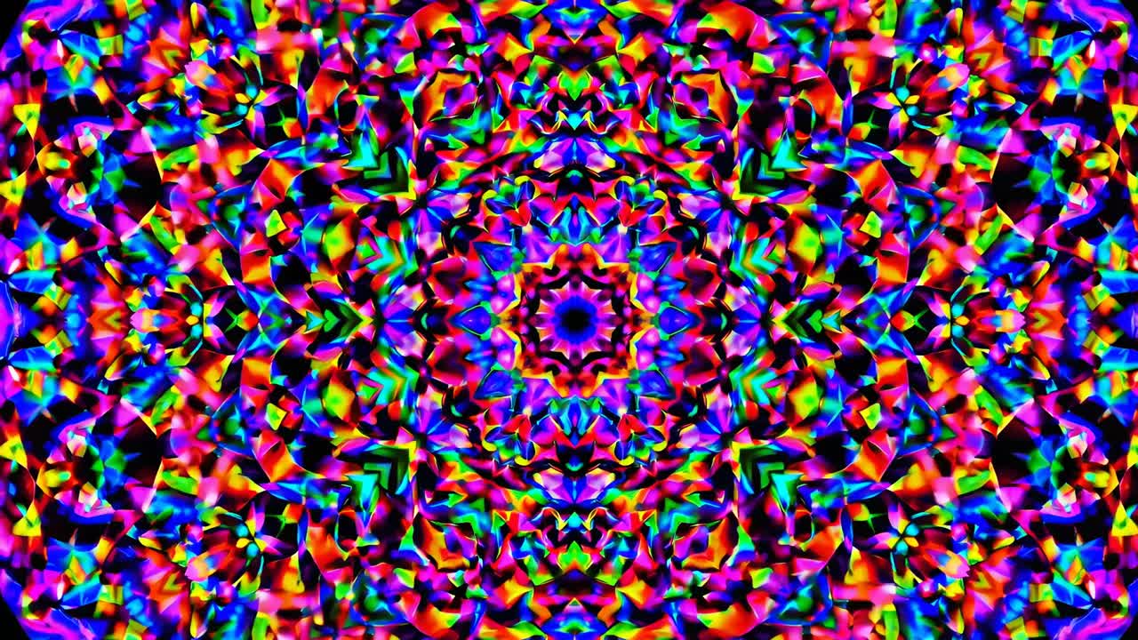 A kaleidoscopic video image with vibrant, symmetrical patterns