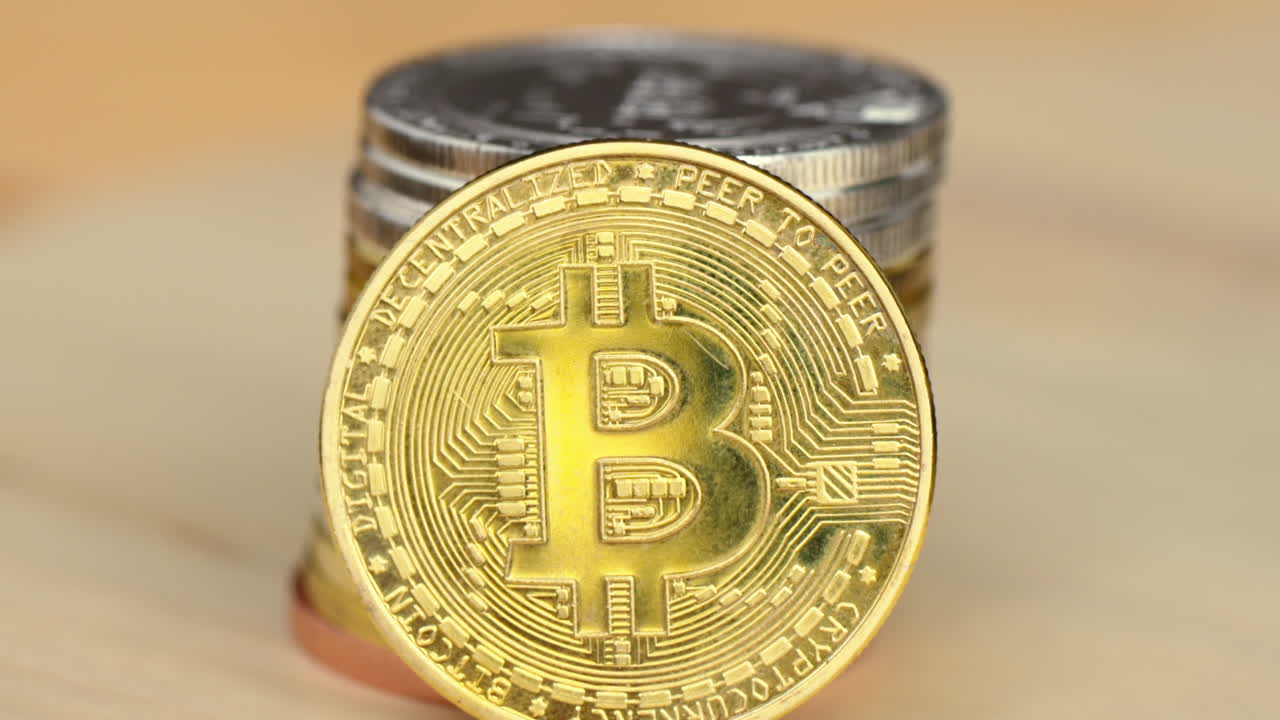 Golden and silver bitcoin crypto money with old dollar coins, close up, graphic video card mining