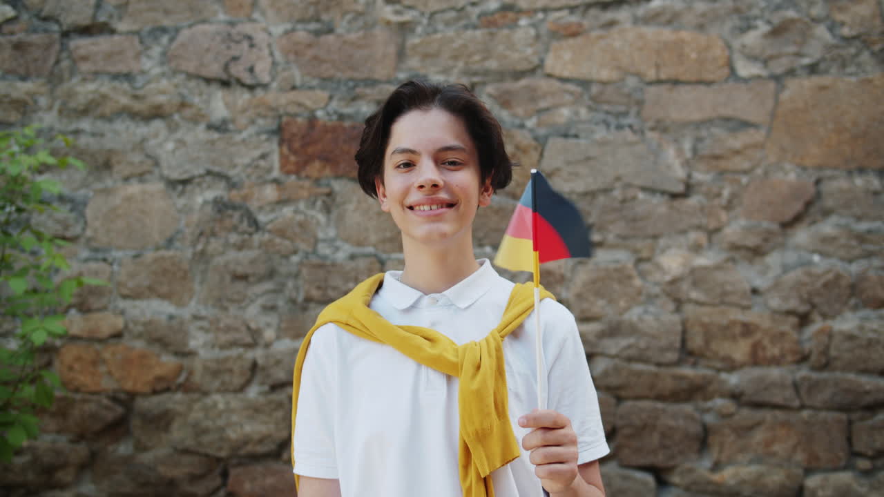 Teenager Holding German Flag