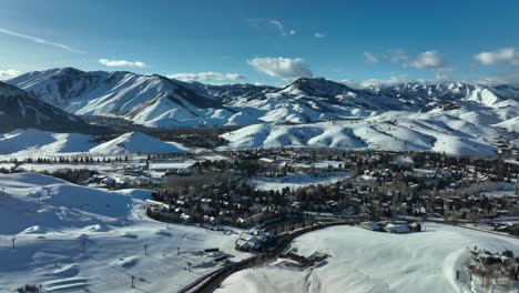 sun valley ski resort town with sloping mountains background covered with snow in idaho