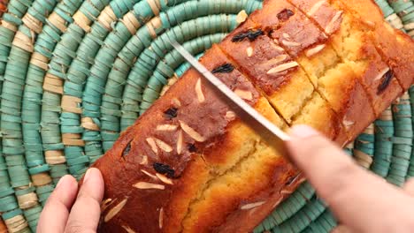 sliced fruitcake on a woven placemat