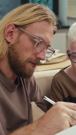 father and son engaging in creative activity