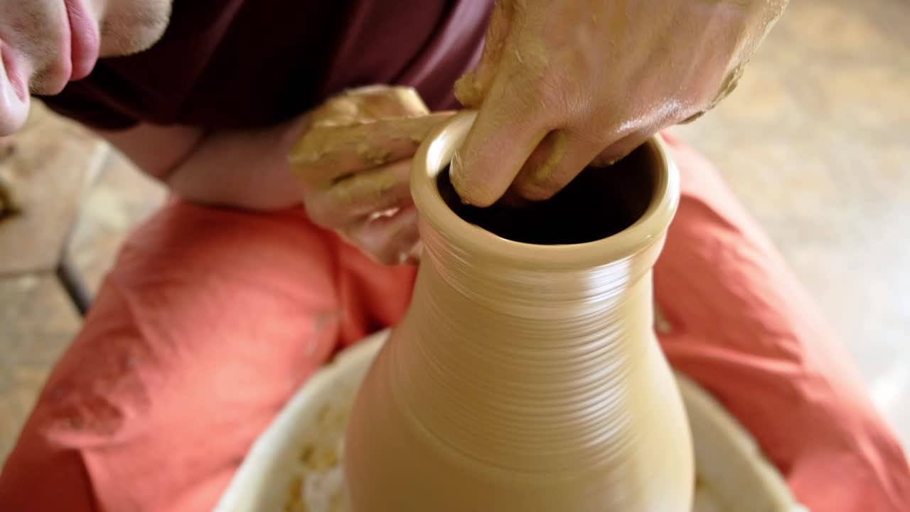 Pottery Artist Shaping Clay on Wheel