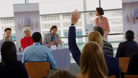 caucasian male speaker questioning the public in a business seminar 4k