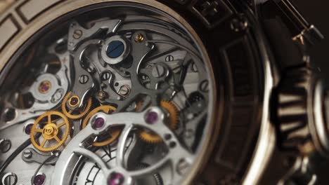extreme close-up of a luxury watch’s exposed mechanical movement, showcasing gears and cogs
