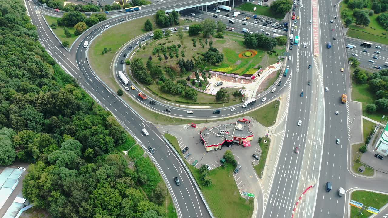 Top down aerial view of highway intersection, camera moving back
