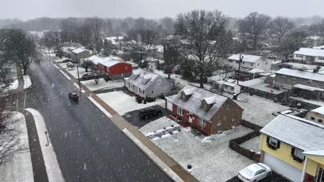 quaint american homes during christmas time snowstorm