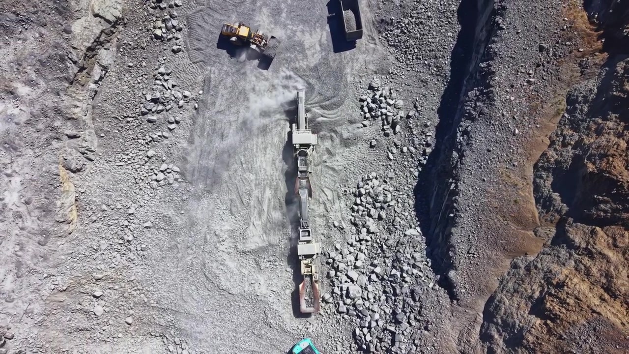 Aerial View of Heavy Machinery Operating in a Rock Quarry
