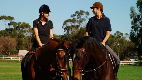 Friends-riding-horse-in-ranch-4k