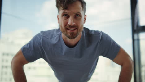 confident man doing workout indoors.