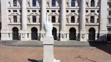 italy , milan july 2020 - drone  aerial view of borsa money exchange -finish lockdown due covid-19 coronavirus, street empty of tourist - piazza affari and new skyline and skyscrapers in downtown - dito medio statue by maurizio cattelan