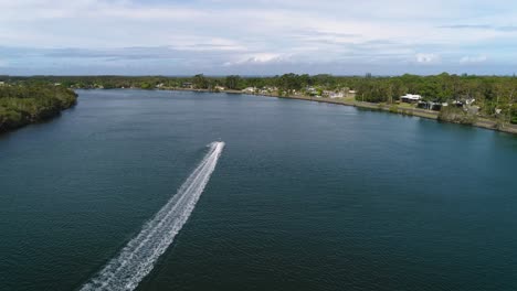 Aerial-view-of-jet-ski-along-the-Tweed-River-near-Chinderah,-Northern-New-South-Wales,-Australia