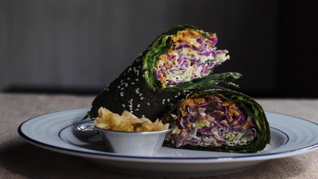 Healthy raw vegan food wrap on a plate (Zoom Out)