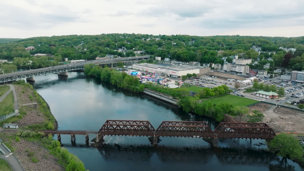 Drone footage of a carnival overlooking a bridge in connecticut