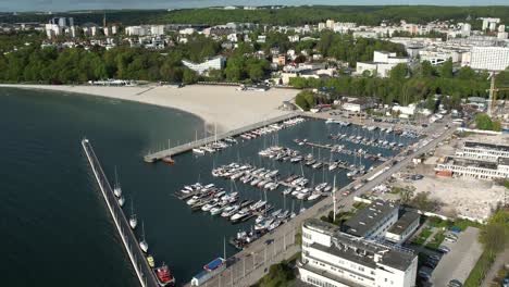 gdynia city beach and marina, with boats docked. aerial view of polish coastline