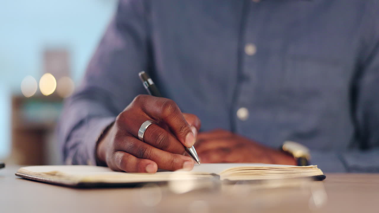 Writing, notebook and hands of black man in office