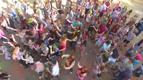 people during holi festival celebrations. vinnitsa, ukraine - july 2017: people throwing colorful paint and powder during holi festival celebrations