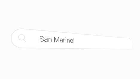 typing san marino in search bar - landlocked country in southern europe. closeup shot
